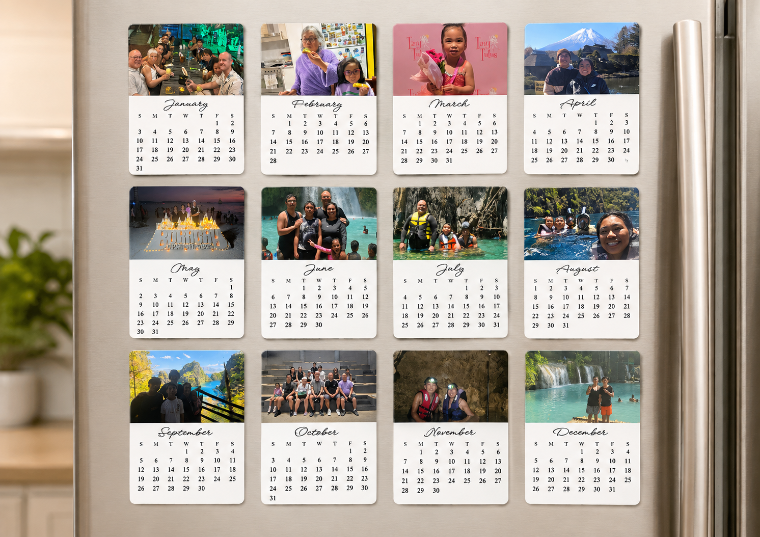 12-month personalised 70 x 100mm photo magnet calendar displayed on a stainless steel fridge
