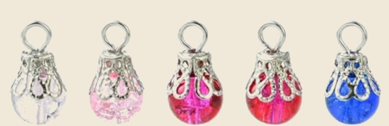 Transparent crackle glass dangle charms in five colours on Memory Snap Co beige background